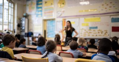 Children listen to their teacher as they sit in a classroom in an elementary school in Paris, France, Sept. 2, 2019. (AFP Photo)