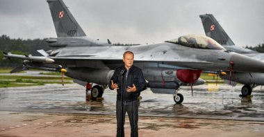 Polish Prime Minister Donald Tusk stands in front of Polish Air Force F-16 fighter jets during a press conference in Lask, Poland, Sept. 11, 2025. (Reuters Photo)