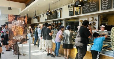People wait in line to place their orders at a bakery in West Covina, California, U.S., Sept. 10, 2025. (AFP Photo)