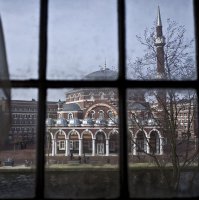Seen through the window of an apartment, people ride their bikes past a mosque in Amsterdam, Netherlands, Monday, March 13, 2017. (AP File Photo)