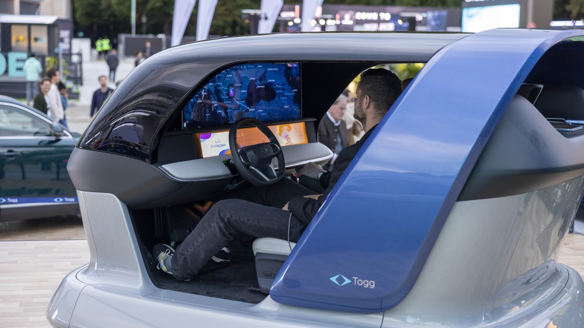 A visitor examines Togg&#039;s AI platform Can.ai, developed jointly with Microsoft Türkiye, during the IAA Mobility auto show, Munich, Germany, Sept. 10, 2025. (Courtesy of Togg)