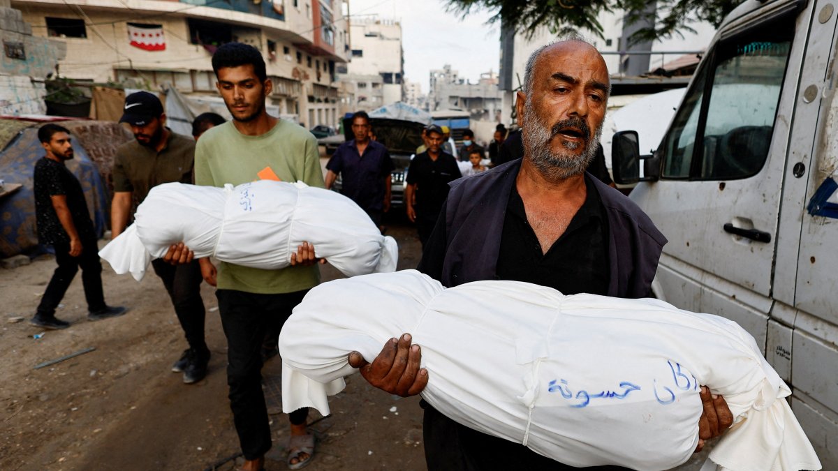 Mourners carry the bodies of Palestinian children killed in overnight Israeli strikes, according to medics, during their funeral at Al-Shifa Hospital in Gaza City, Sept. 7, 2025. (Reuters Photo)