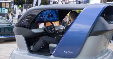 A visitor examines Togg&#039;s AI platform Can.ai, developed jointly with Microsoft Türkiye, during the IAA Mobility auto show, Munich, Germany, Sept. 10, 2025. (Courtesy of Togg)