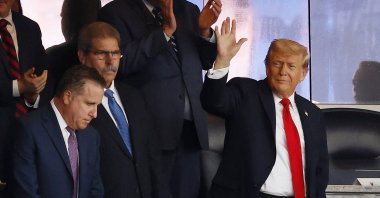 U.S. President Donald Trump (R) waves as he attends the New York Yankees game against the Detroit Tigers at Yankee Stadium, New York City, U.S., Sept. 11, 2025. (AFP Photo)