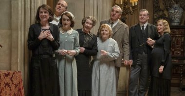 Raquel Cassidy, (from left) Kevin Doyle, Sophie McShera, Phyllis Logan, Lesley Nicol, Jim Carter, Brendan Coyle and Joanne Froggatt in a scene from &quot;Downton Abbey: The Grand Finale.&quot; (Focus Features Handout via AP Photo)