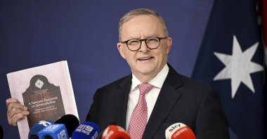 Australian Prime Minister Anthony Albanese holds a copy of the National Response to Islamophobia report as he speaks to the media during a press conference at the Commonwealth Parliamentary Offices, Sydney, Australia, Sept. 12, 2025. (AP Photo)