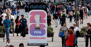 People walk past the FIFA World Cup 2026 countdown clock at Paseo Alcalde in Guadalajara, Jalisco state, Mexico, Sept. 10, 2025. (AFP Photo)
