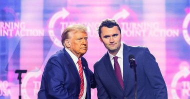 Charlie Kirk (R) speaks on stage with President Donald Trump at America Fest 2024, Phoenix, U.S., Dec. 22, 2024. (AFP Photo)
