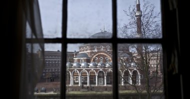 Seen through the window of an apartment, people ride their bikes past a mosque in Amsterdam, Netherlands, Monday, March 13, 2017. (AP File Photo)