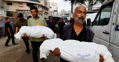 Mourners carry the bodies of Palestinian children killed in overnight Israeli strikes, according to medics, during their funeral at Al-Shifa Hospital in Gaza City, Sept. 7, 2025. (Reuters Photo)