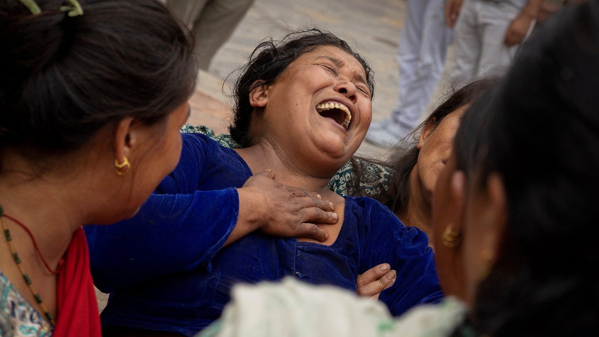 Bhagwati Balami, mother of Subhlal Balami, 28, who died in last week's anti-corruption protests, mourns during his cremation, in Kathmandu, Nepal, Sept. 14, 2025. (Reuters Photo)