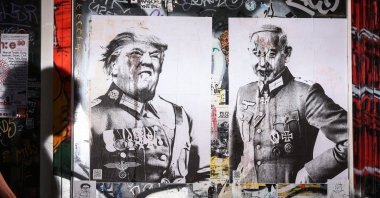 Posters depict U.S. President Trump and Israeli Prime Minister Netanyahu in Nazi uniform and regalia, Berlin, Germany, Sept. 6, 2025. (EPA Photo)