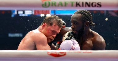 Canelo Alvarez exchanges punches with Terence Crawford in their undisputed super middleweight title fight in Las Vegas, Nevada, Sept. 13, 2025. (AFP Photo)