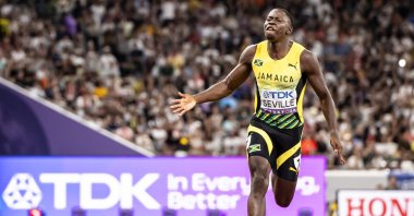 Winner Oblique Seville of Jamaica crosses the finish line to win the men's 100-meter final during day two of the World Athletics Championships Tokyo 2025 at the National Stadium in Tokyo, Japan, Sept. 14, 2025. (EPA Photo)
