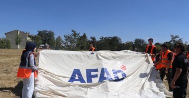 Volunteers compete in disaster response drills, including stretcher carrying, tent setup and water transport, in Ağrı, Türkiye, Sept. 7, 2025. (AA Photo)