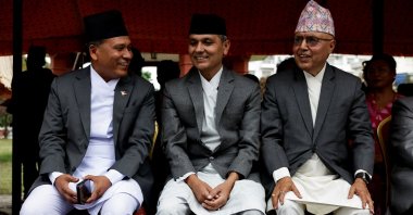 Newly appointed Finance Minister Rameshore Khanal, Energy Minister Kulman Ghising, and Home Minister Om Prakash Aryal smile as they speak with each other after taking the oath of office, in Kathmandu, Nepal, Sept. 15, 2025. (Reuters Photo)