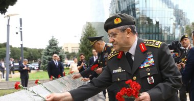 Chief of General Staff Gen. Selçuk Bayraktaroğlu lays carnations at the graves of fallen soldiers during a ceremony at the Turkish Martyrs’ Cemetery, Baku, Azerbaijan, Sept. 15, 2025. (AA Photo)