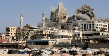Smoke rises from the evacuated Al-Ghefari tower, as it collapses after it was hit by Israeli air strikes, in Gaza City, Sept. 15, 2025. (Reuters Photo)