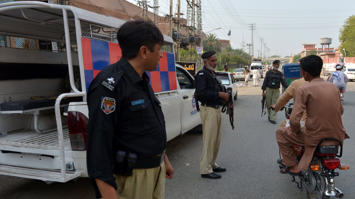 Pakistani security officials stand guard at a checkpoint, as security has been intensified after 12 soldiers were killed near the Pak-Afghan border, in Peshawar, Khyber Pakhtunkhwa province, Pakistan, Sept. 13, 2025. (EPA Photo)