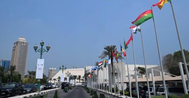 Flags fly along the road leading to the hotel where the upcoming Arab-Islamic summit, organized to discuss the recent Israeli attack on Qatar, will take place, Doha, Qatar, Sept. 14, 2025. (AFP Photo)