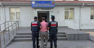 Gendarmerie officers escort a captured FETÖ suspect in Kayseri, central Türkiye, Sept. 10, 2025. (İHA Photo)
