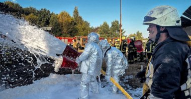 Firefighters deploy foam at the site of an industrial enterprise facility hit by a Russian drone strike, in Kyiv region, Ukraine, Sept. 16, 2025. (Reuters Photo)
