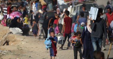 Displaced Palestinians move with their belongings southwards on a road in the Nuseirat refugee camp area in the central Gaza Strip following renewed Israeli evacuation orders for Gaza City, Sept. 16, 2025. (AFP Photo)