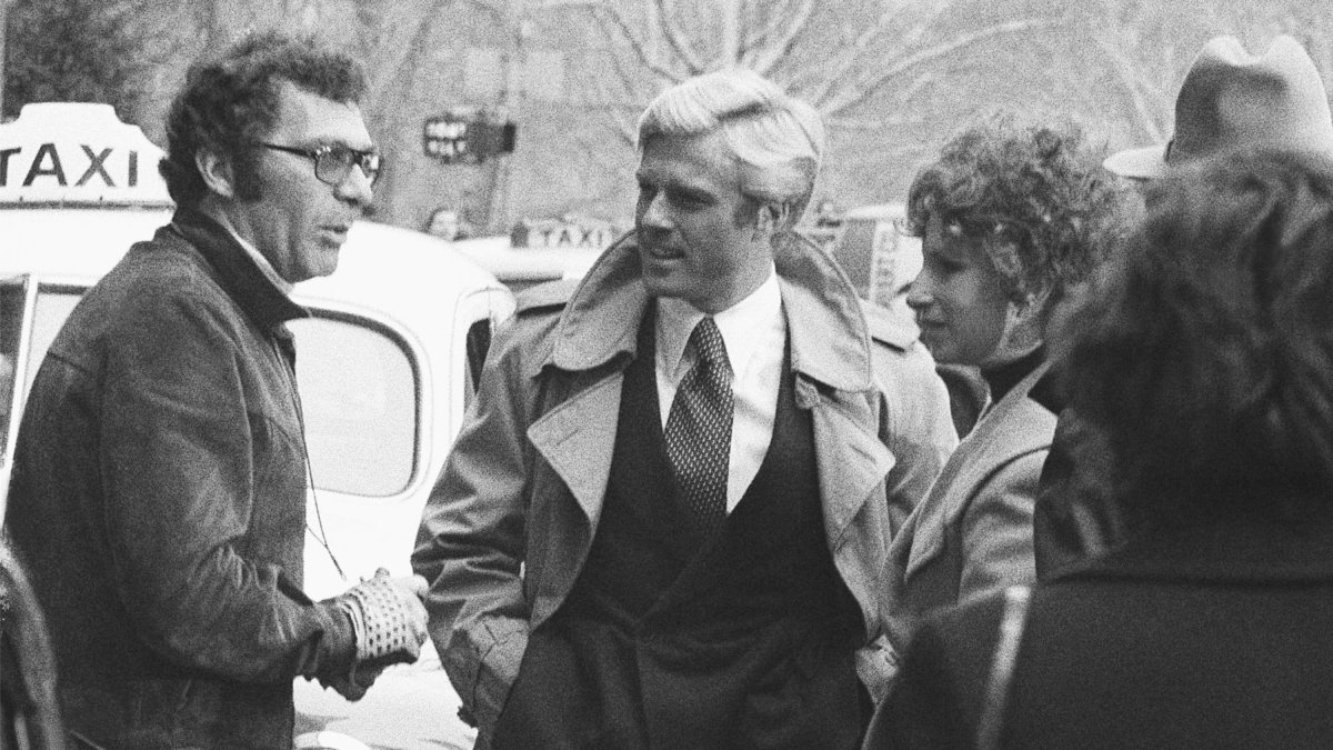 Director Sydney Pollack (L) speaks with actors Robert Redford (C) and Barbra Streisand during the filming of &quot;The Way We Were,&quot; New York, U.S., Nov. 28, 1972. (AP Photo)