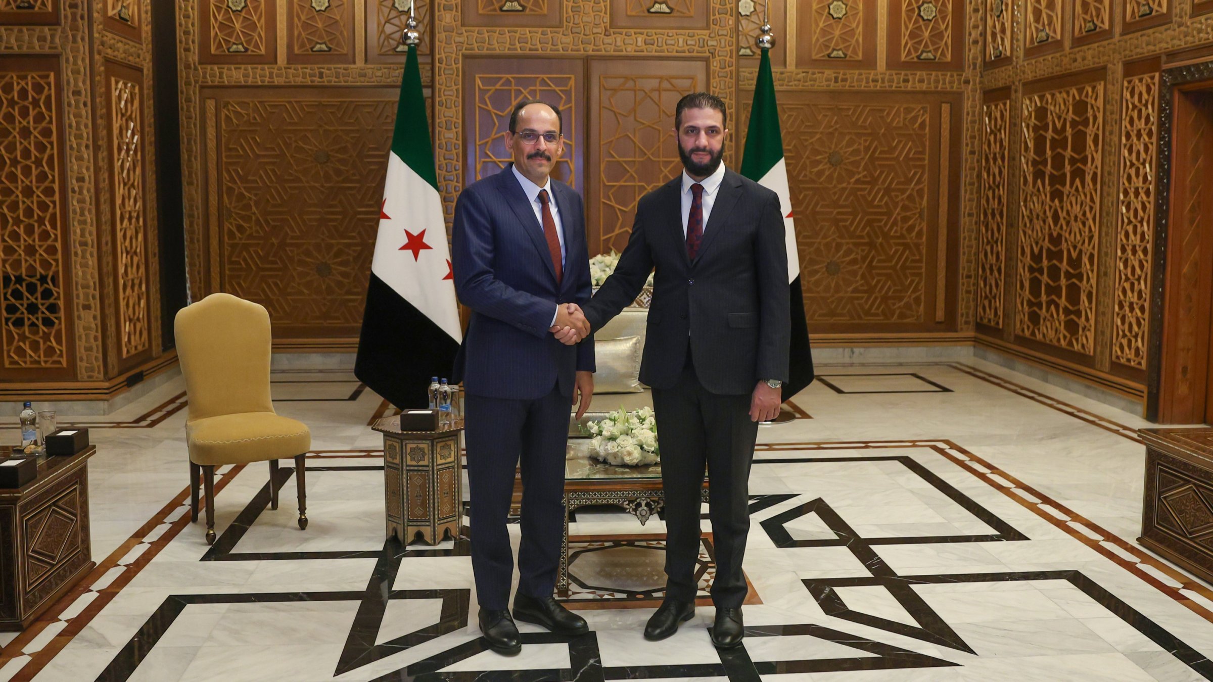 MIT Chief Ibrahim Kalın and Syria&#039;s President Ahmed al-Sharaa shake hands after meeting in Damascus, Sept. 17, 2025. (AA Photo)