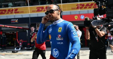 Ferrari&#039;s British driver Lewis Hamilton walks near the track before the first practice session ahead of the Italian Formula One Grand Prix at the Autodromo Nazionale Monza circuit, Monza, Italy, Sept. 5, 2025. (AFP Photo)