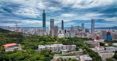 An aerial view of Taipei&#039;s skyline featuring Taipei 101 and lush green areas, Taipei, Taiwan. (Shutterstock Photo)