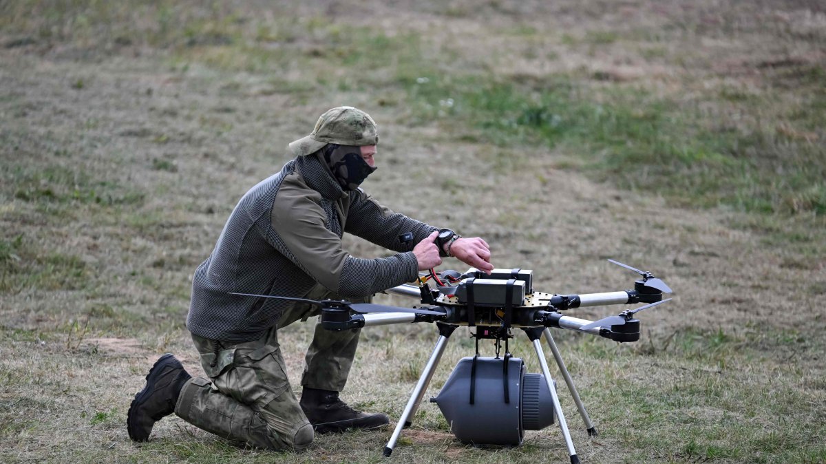 A serviceman works on a drone during the "Zapad-2025" (West-2025) joint Russian-Belarusian military drills at a training ground near the town of Borisov, east of the capital Minsk, Belarus, Sept. 15, 2025. (AFP Photo)