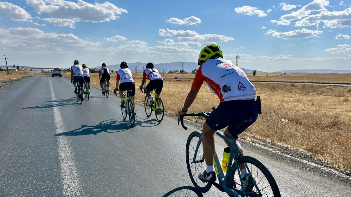 Turkish and American volunteers cycle from the Ani Ruins to Tatvan to raise funds for education, Kars, Türkiye, Sept. 18, 2025. (AA Photo)