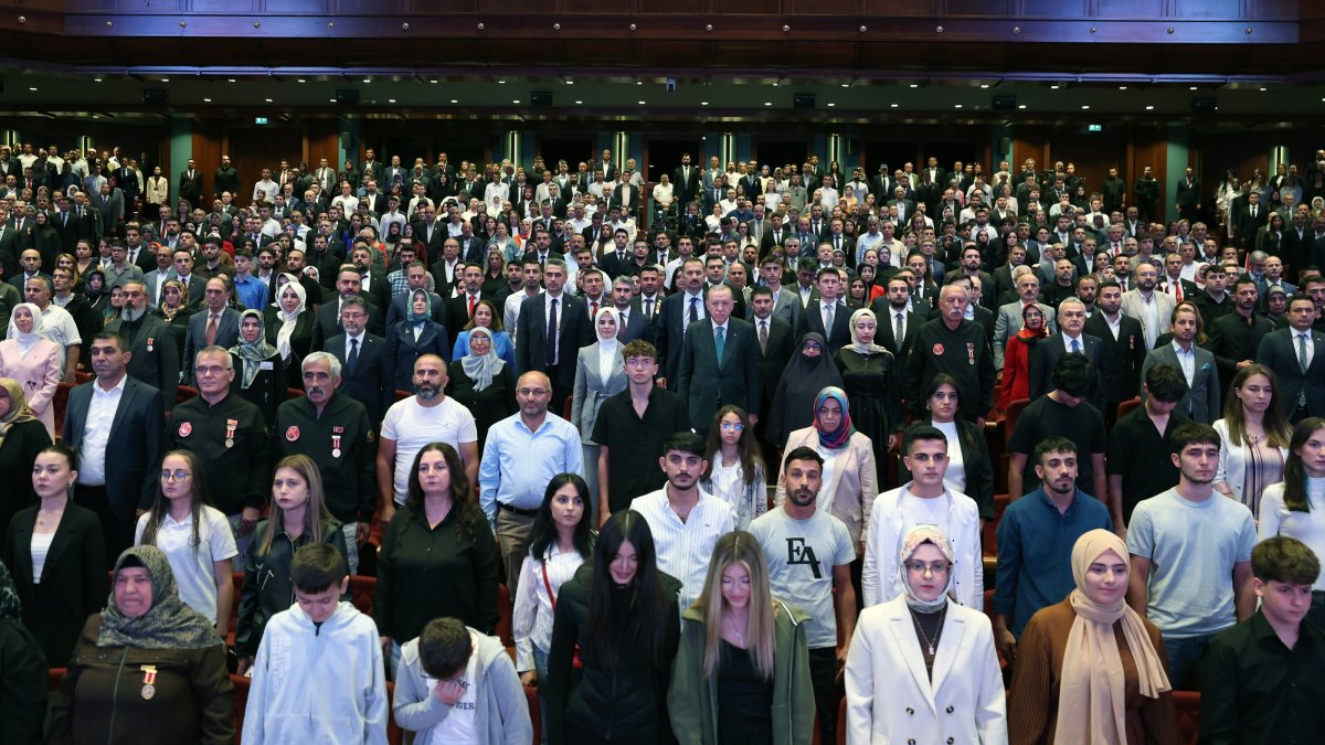 President Recep Tayyip Erdoğan and families of martyrs and veterans recite the national anthem during the event, Ankara, Türkiye, Sept. 18, 2025. (AA Photo)