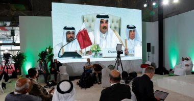 Journalists watch on a screen at the media center as Sheikh Tamim bin Hamad Al Thani, the emir of Qatar, speaks during the opening of the emergency Arab-Islamic summit, Doha, Qatar, Sept.15, 2025. (Reuters Photo)