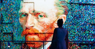 A visitor explores &quot;Van Gogh: In the Footsteps of Light&quot; exhibition. (Courtesy of IBB Culture)