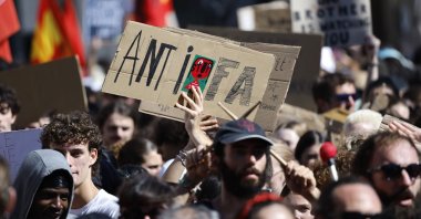 A protester holds a sign reading &quot;Antifa&quot; at a rally in Montpellier, France, Sept. 10, 2025. (EPA Photo)