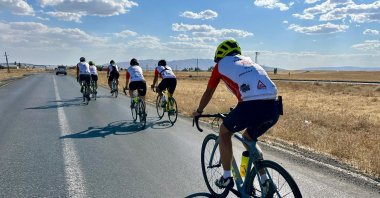 Turkish and American volunteers cycle from the Ani Ruins to Tatvan to raise funds for education, Kars, Türkiye, Sept. 18, 2025. (AA Photo)