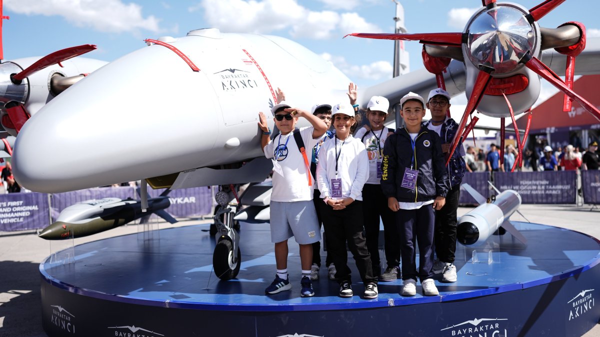 Children pose with a Bayraktar Akıncı drone, one of Türkiye&#039;s leading uncrewed combat aerial vehicles, during the Teknofest aviation and technology festival at Atatürk Airport, Istanbul, Türkiye, Sept. 19, 2025. (AA Photo)