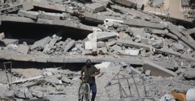 Destroyed buildings line the streets of Khan Yunis as displaced Palestinians set up tents and seek shelter following brutal Israeli attacks, Gaza, Palestine, Sept. 13, 2025. (AA Photo)