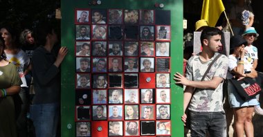 Relatives and supporters of hostages display a sign during a protest outside the Prime Minister's residence, calling for their release and an end to the war in the Gaza Strip, in Jerusalem, Sept. 19, 2025. (EPA Photo)