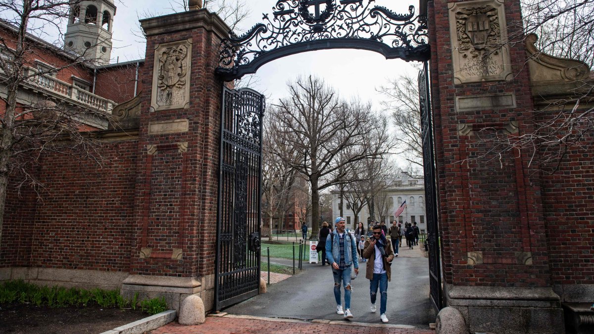 People walk through a gate as they exit Harvard Yard on the campus of Harvard University campus in Cambridge, Massachussetts, U.S. on April 15, 2025. (AFP Photo)