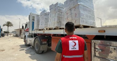 A Kızılay member oversees a truck loaded with humanitarian aid to support Al Emel and Al Mawasi hospitals, Gaza, Palestine, Sept. 21, 2025. (AA Photo)