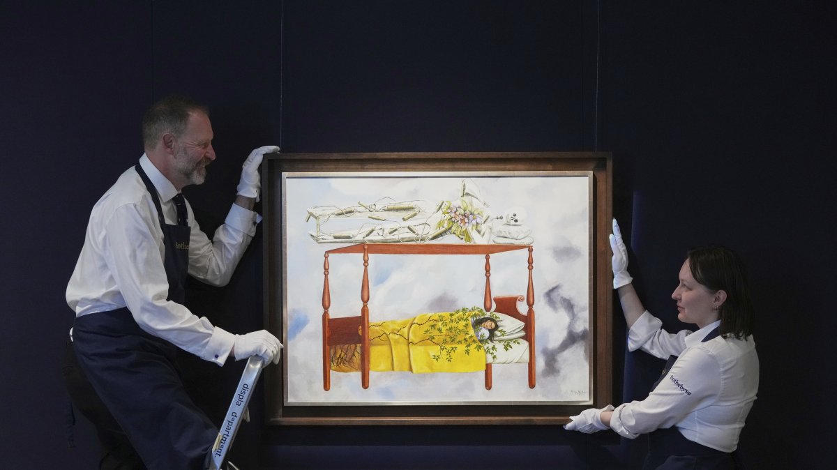 A painting by Frida Kahlo called &quot;El sueño (La cama)&quot; is displayed at Sotheby&#039;s auction rooms, part of a collection of surrealist masterpieces unveiled in London ahead of their sale in New York, U.S., Sept. 19, 2025. (AP Photo)