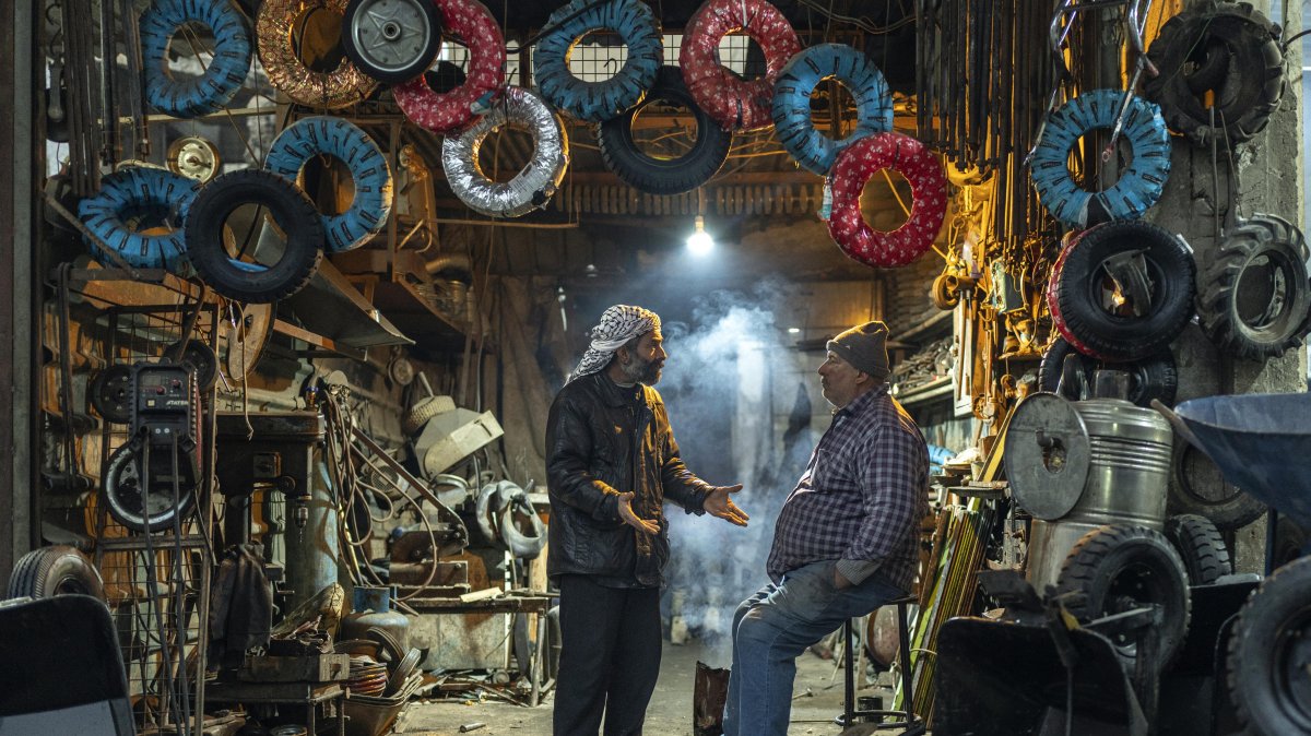 Workers at a tire shop wait for customers in Douma, on the outskirts of Damascus, Syria, Dec. 29, 2024 (AP Photo)