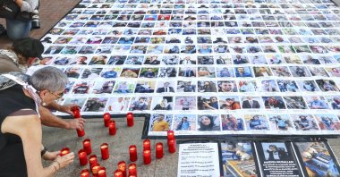 People pay tribute and remember the 302 journalists, reporters, photographers and cameramen killed in Gaza, during a rally, Logrono, La Rioja, Spain, Sept. 13, 2025. (EPA Photo)