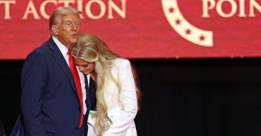 US President Donald Trump greets Erika Kirk, Charlie Kirk&#039;s widow, during the public memorial service for right-wing activist Charlie Kirk at State Farm Stadium in Glendale, Arizona, Sept. 21, 2025. (AFP Photo)