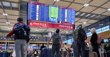 Passengers are seen in front of the check-in counters in Terminal 1 at Berlin Brandenburg Airport after a widespread cyberattack on European airports, Sch&#039;nefeld, Germany, Sept. 22, 2025. (AP Photo)