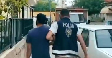 Police arrest a cybercrime suspect during nationwide operations, Ankara, Türkiye, Sept. 21, 2025. (AA Photo)