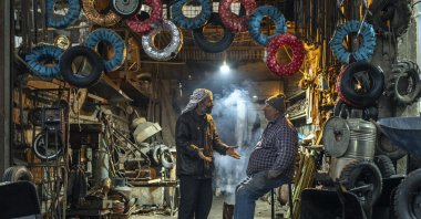 Workers at a tire shop wait for customers in Douma, on the outskirts of Damascus, Syria, Dec. 29, 2024 (AP Photo)